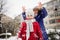 Mother with daughter cheerfully spend time in winter day.