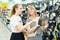 Mother and daughter choose frying pan in shop