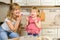 Mother and daughter cooking at home. Christmas biscuits. Sweet home. Merry Christmas. Happy Holidays. Family preparation holiday