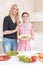 Mother and daughter cooking salad