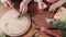 Mother and daughter cutting onion and garlic on wooden board