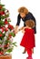 Mother and daughter decorate Xmas tree