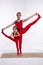 Mother daughter doing yoga exercise, fitness, gym wearing the same comfortable tracksuits, family sports, sports paired