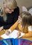 Mother and daughter drawing together