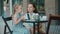 Mother with daughter drinks tea in cafe