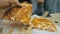 Mother and daughter eat pizza cheese four. Close up of young woman eating pizza and chewing in outdoor restaurant. Girl