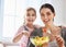 Mother and daughter eating salad