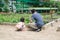 Mother and daughter engaged in gardening together