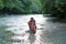 Mother and daughter enjoy the view of the Acheron river with its pristine nature in Epirus, Greece