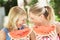 Mother And Daughter Enjoyin Water Melon
