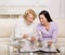 Mother and daughter enjoying photo album