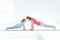 Mother and daughter exercising on yoga mats