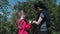 Mother and daughter explore wild rose bush