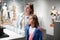 Mother and daughter exploring antique statues