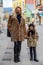 Mother with daughter with face masks wearing leopard fashion