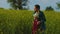 mother and daughter farming family in the rapeseed field