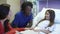 Mother And Daughter With Female Nurse in Hospital Room