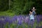 Mother & Daughter in Field of Lupine Flowers