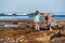 Mother daughter fishing beach