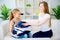 Mother and daughter folding laundry