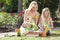 Mother & Daughter Gardening Planting Flowers