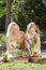 Mother & Daughter Gardening Planting Flowers