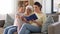 Mother, daughter and grandma reading book at home