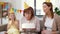 Mother, daughter, grandmother with birthday cake