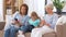 Mother, daughter and grandmother with gadgets