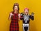 Mother and daughter in halloween costume frightening