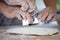 Mother and daughter hands prepare a dough for baking cookies