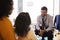 Mother And Daughter Having Consultation With Male Pediatrician In Hospital Office