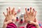 Mother and daughter having fun painting fingernails