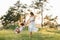 Mother and daughter having fun in the park. Happiness and harmony in family life. Beauty nature scene with family outdoor