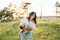 Mother and daughter having fun in the park. Happiness and harmony in family life. Beauty nature scene with family outdoor