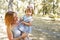 Mother and daughter having fun in the park. Happiness and harmony in family life. copy space