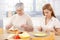 Mother and daughter having lunch at home