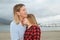 Mother and daughter hugged and happy show their affection next to the sea