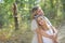 Mother and daughter hugged and relaxed in a forest