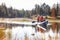 Mother and daughter kayaking on lake, front view