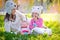 Mother and daughter in knit hats bears in the park