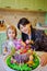 mother and daughter with a large cake with figures of fairy-tale characters