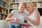 Mother and daughter looking at pictures