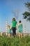 Mother and daughter looking at the plant chimney-stacks