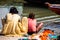 Mother and daughter of low caste washing their clothes in the Ganges river, in Varanasi, India