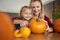 Mother and daughter making carved pumpkin