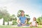 Mother and daughter meditating together in the garden