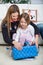 Mother And Daughter Opening Christmas Present