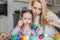 Mother And Daughter Painting Easter Eggs In Home