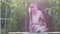 Mother and daughter painting old wood in the garden close up. Home workshop, handicrafts, hand-made concept